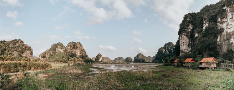 Panoramic view of Lotus Field Homestay in Ninh Binh with mountains, rice fields and private villas